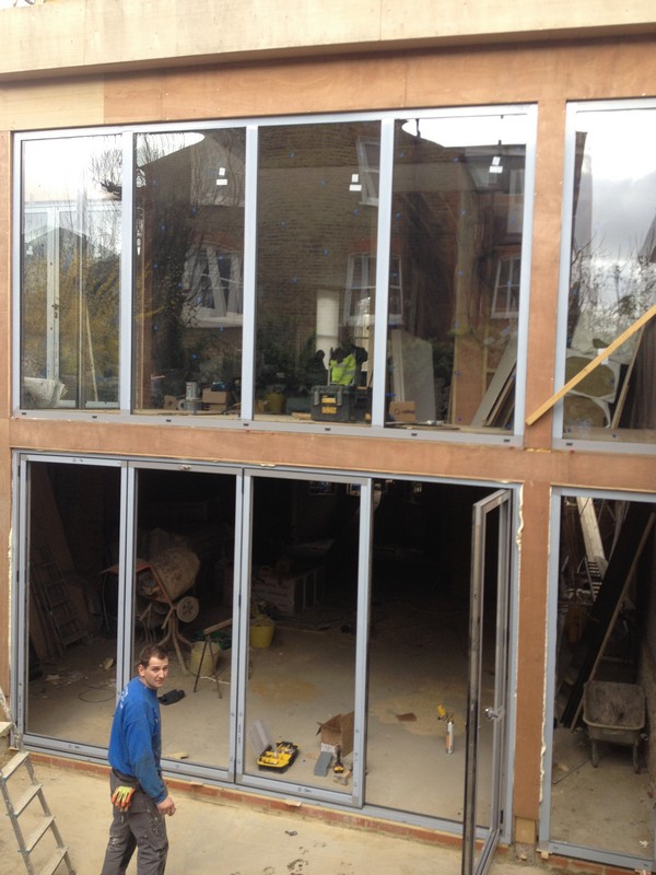 Aluminium bi-fold doors with two-storey glazing in Streatham