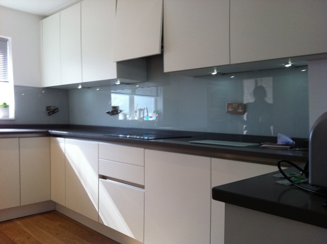 Grey glass kitchen splashback with LED lighting in Streatham