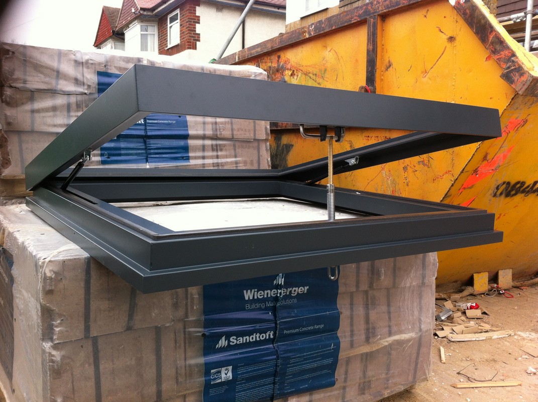 Opening flat roof skylight in anthracite grey installed in Streatham